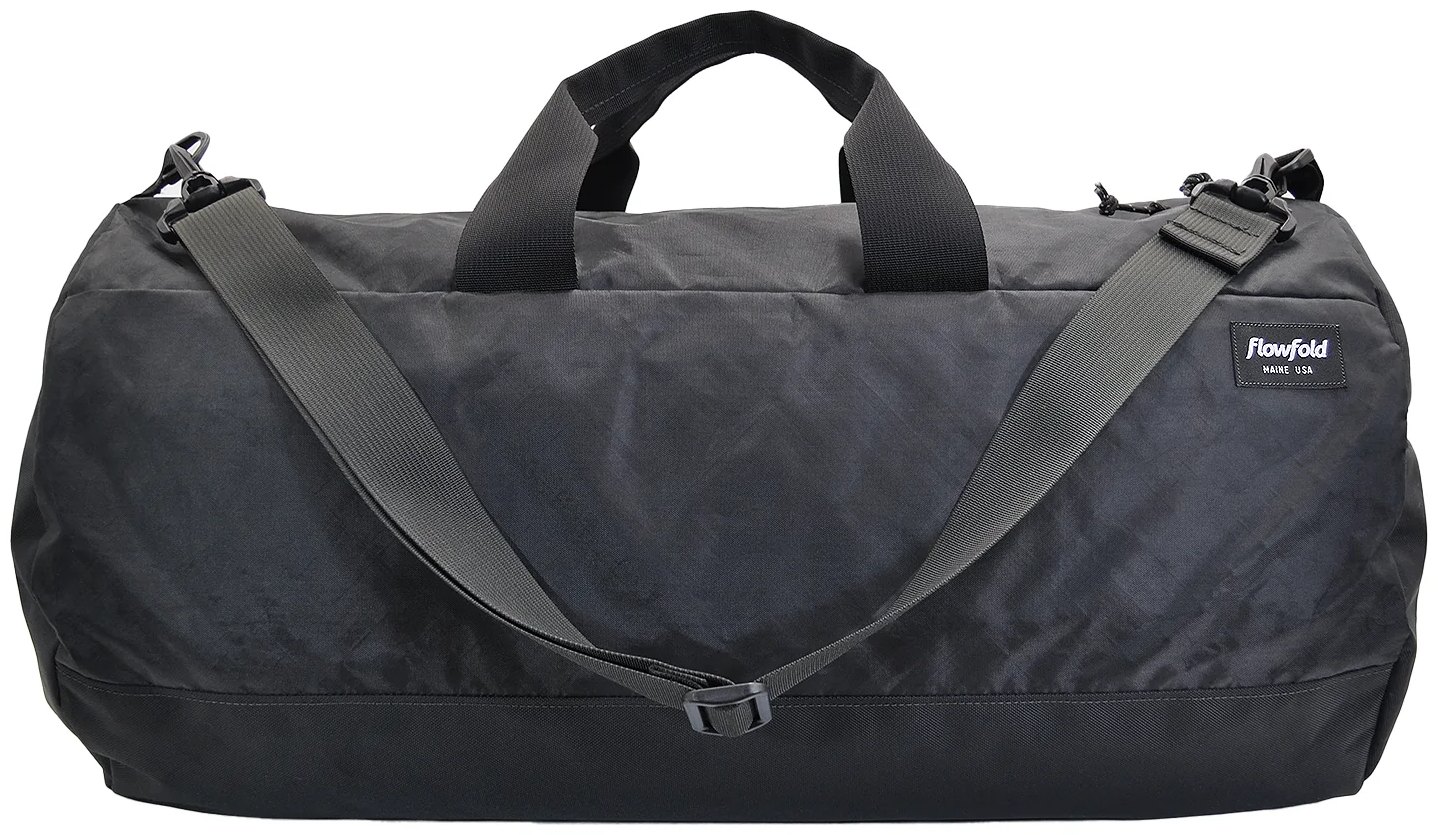 Black 40 litre duffel bag with double zip along the main compartment, top carry handles and an adjustable shoulder strap.